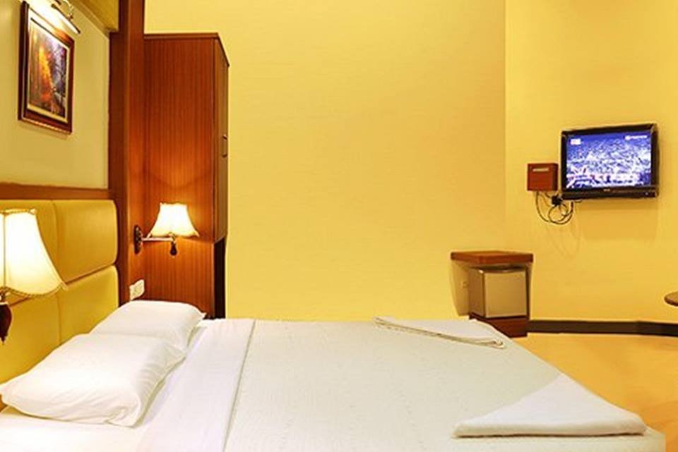 Comfortable guest room at Hotel Omkar
